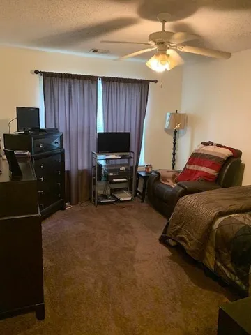 a bedroom with a bed and furniture