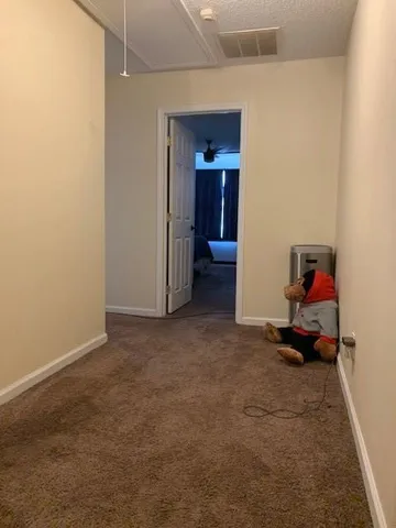 a room with furniture and white walls