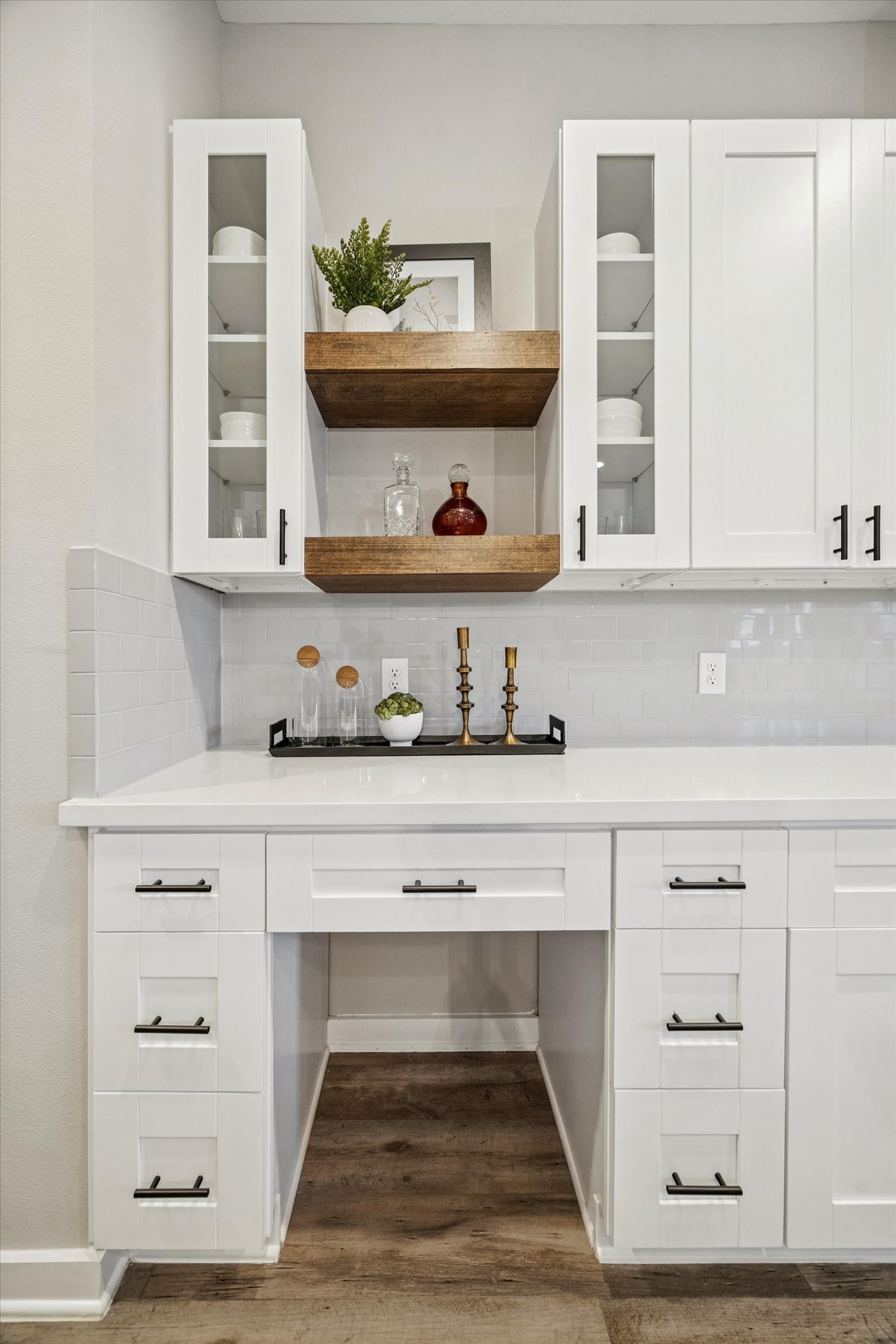 11325 Stonework Grove Lane Houston, TX 77076 - Photo 12 of 39 a living room with white cabinets and a wooden floor