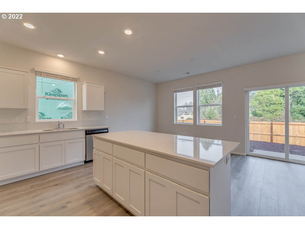 2928 V Street Springfield, OR 97477 - Photo 5 of 23 a kitchen with a sink cabinets and wooden floor