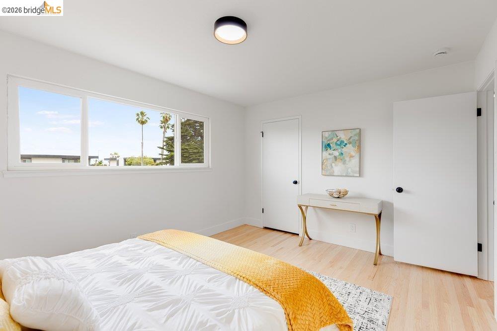 1298 Ribbon Street Foster City, CA 94404 - Photo 51 of 86 Bedroom featuring light wood-finish flooring, white walls, and a multi-pane window