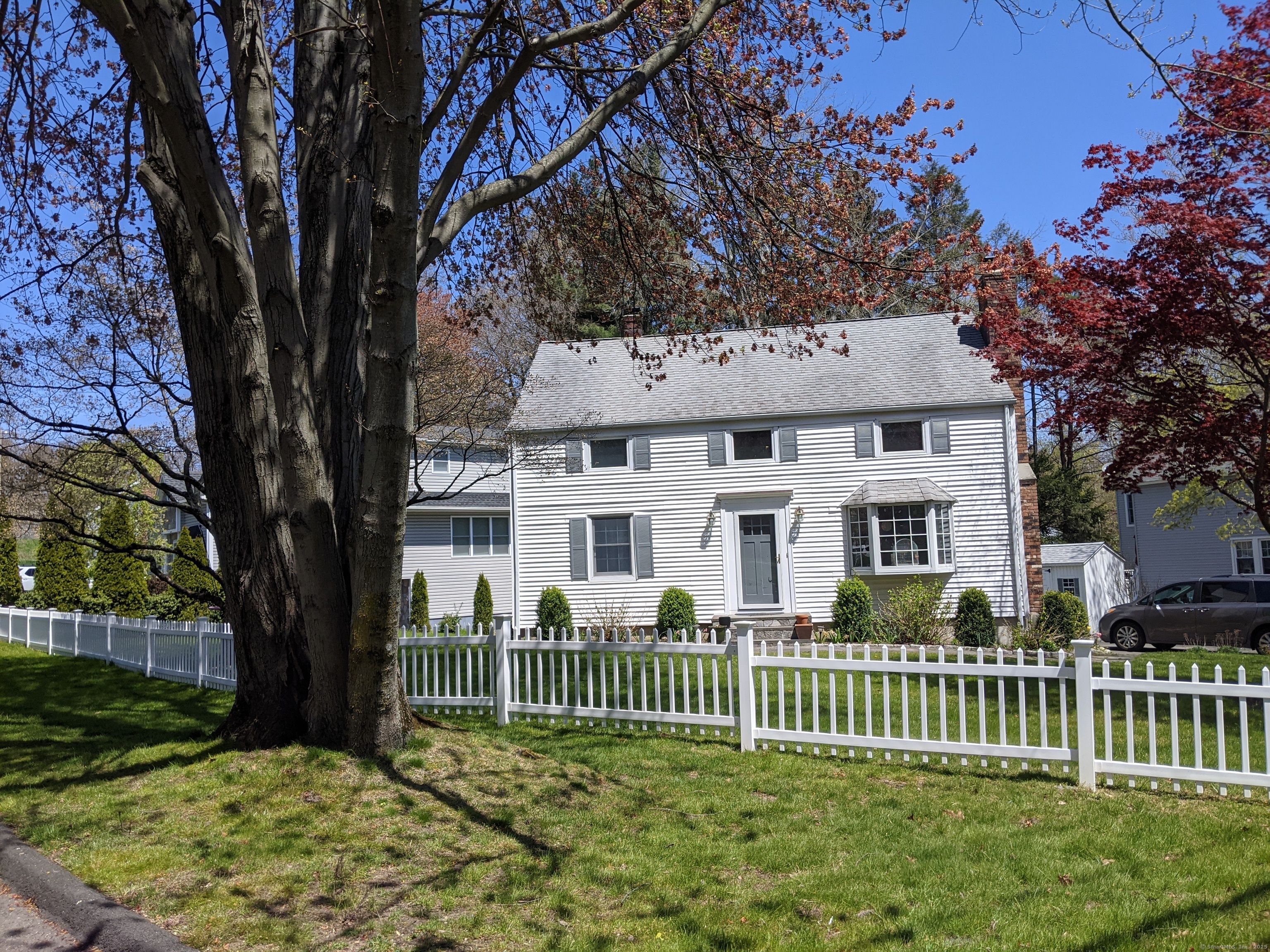 2 Warner Drive Darien, CT 06820 - Photo 1 of 1 a front view of a house with a garden