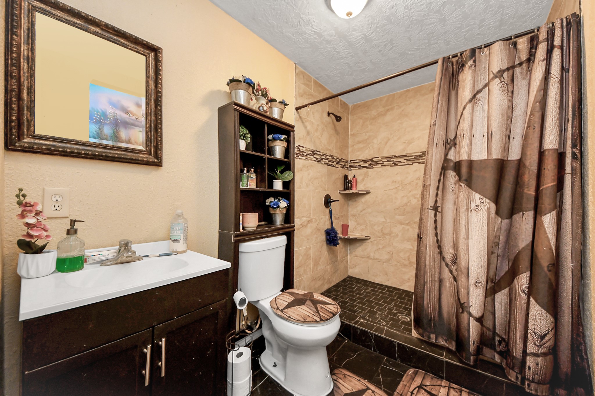 1040 County Road 5007 Cleveland, TX 77327 - Photo 14 of 47 a bathroom with a sink a toilet and shower