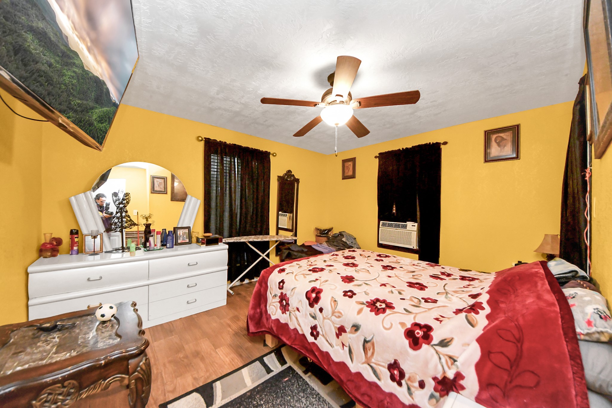 1040 County Road 5007 Cleveland, TX 77327 - Photo 16 of 47 a bedroom with a bed and a dresser