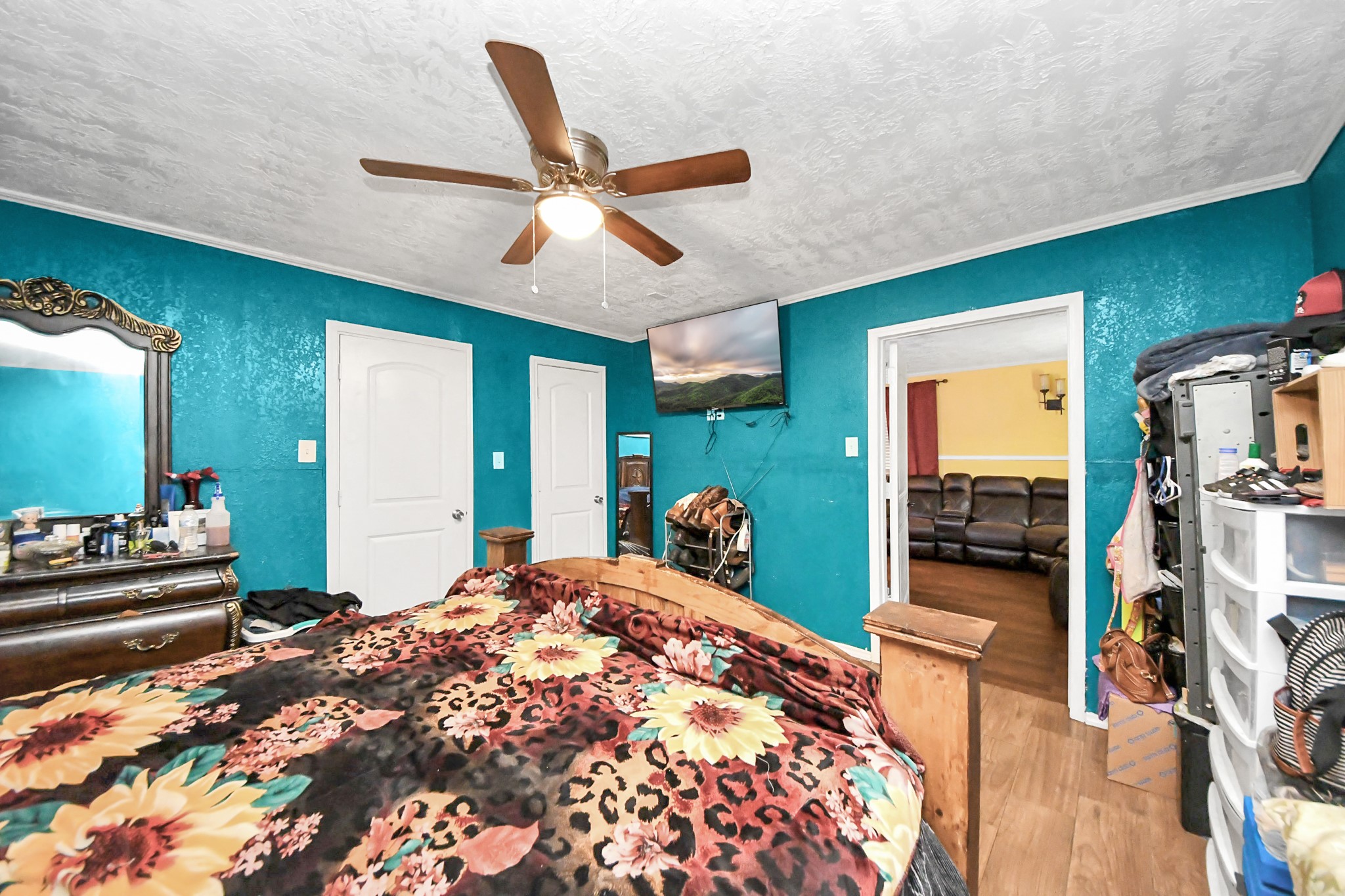 1040 County Road 5007 Cleveland, TX 77327 - Photo 22 of 47 a bedroom with a bed and a large mirror