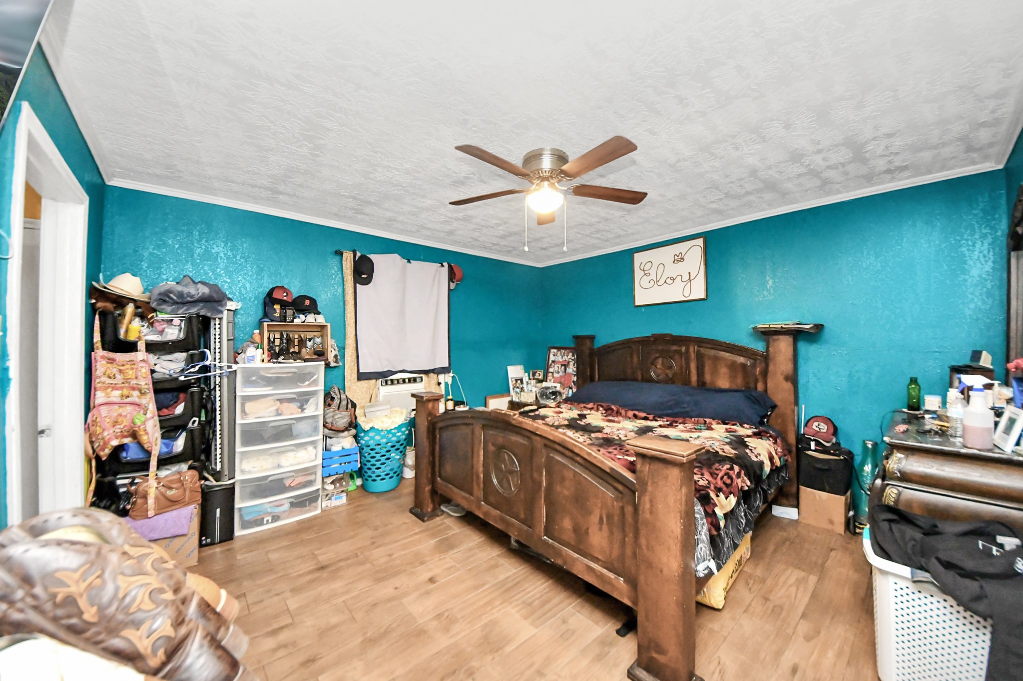 1040 County Road 5007 Cleveland, TX 77327 - Photo 23 of 47 a bedroom with bed and a large window