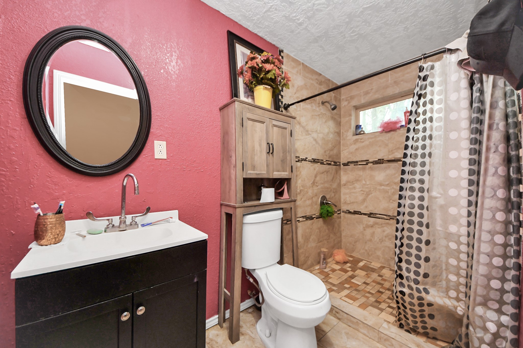 1040 County Road 5007 Cleveland, TX 77327 - Photo 25 of 47 a bathroom with a sink a toilet and a mirror