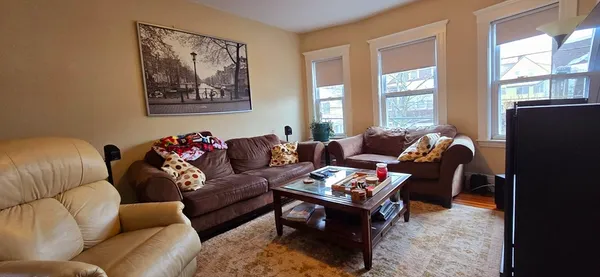 a living room with furniture or couch and a window
