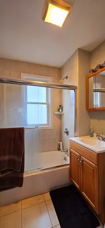 a bathroom with a bathtub and a sink