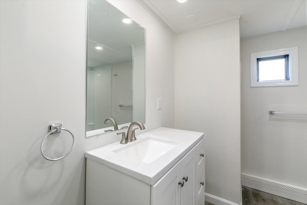 5 E Street Merrimac, MA 01860 - Photo 16 of 25 a bathroom with a sink toilet and mirror