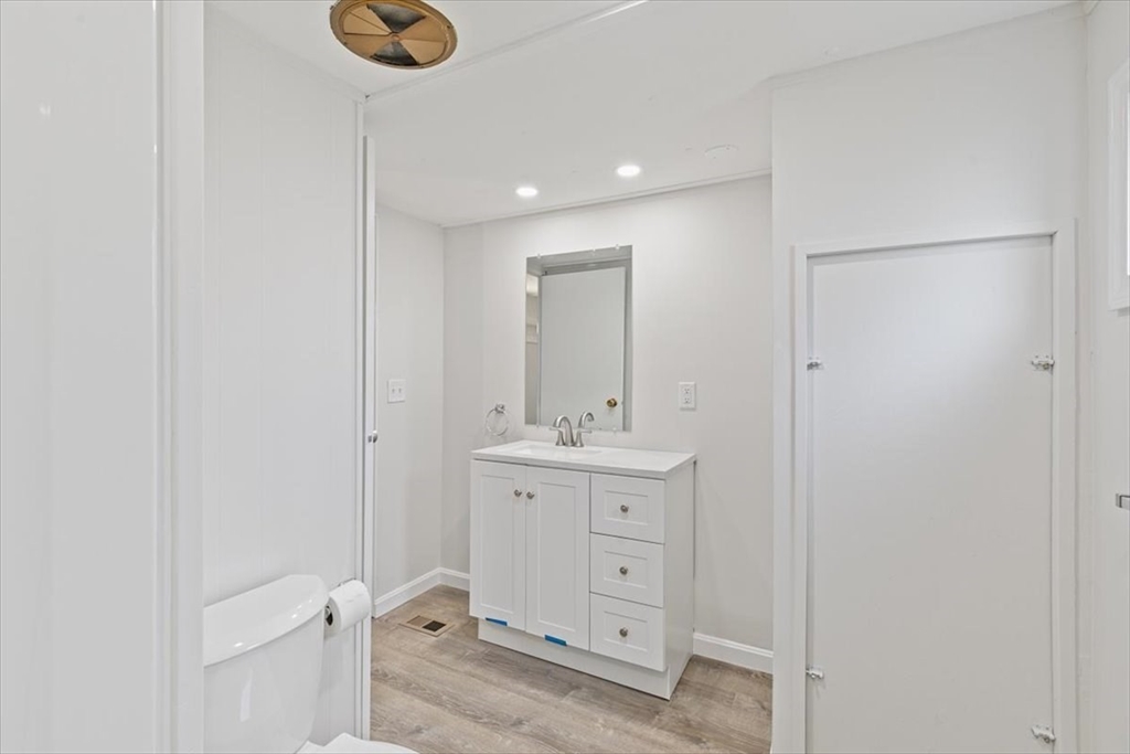 5 E Street Merrimac, MA 01860 - Photo 17 of 25 a bathroom with a shower sink and mirror