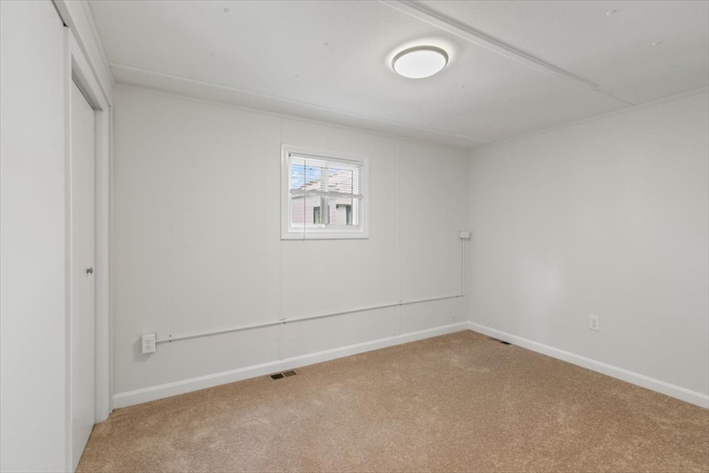 5 E Street Merrimac, MA 01860 - Photo 23 of 25 an empty room with a workbench