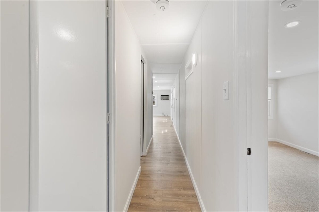 5 E Street Merrimac, MA 01860 - Photo 25 of 25 a view of a hallway with a wooden floor