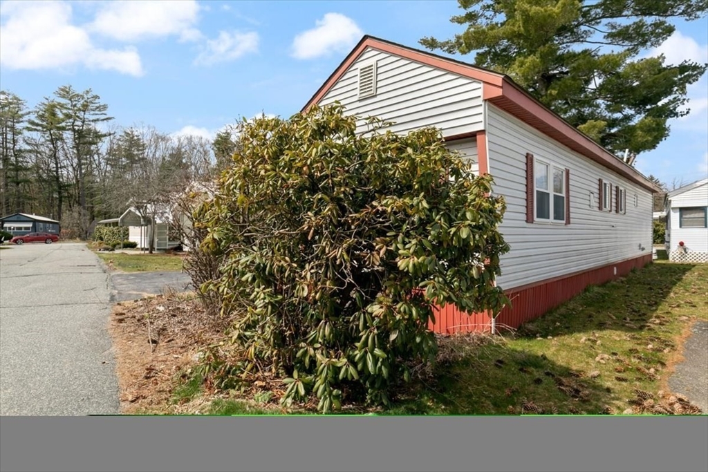 5 E Street Merrimac, MA 01860 - Photo 4 of 25 a backyard of a house with lots of green space