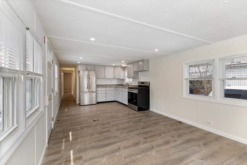 5 E Street Merrimac, MA 01860 - Photo 7 of 25 a view of kitchen with wooden floor