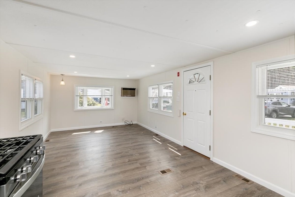 5 E Street Merrimac, MA 01860 - Photo 10 of 25 an empty room with windows and cabinet