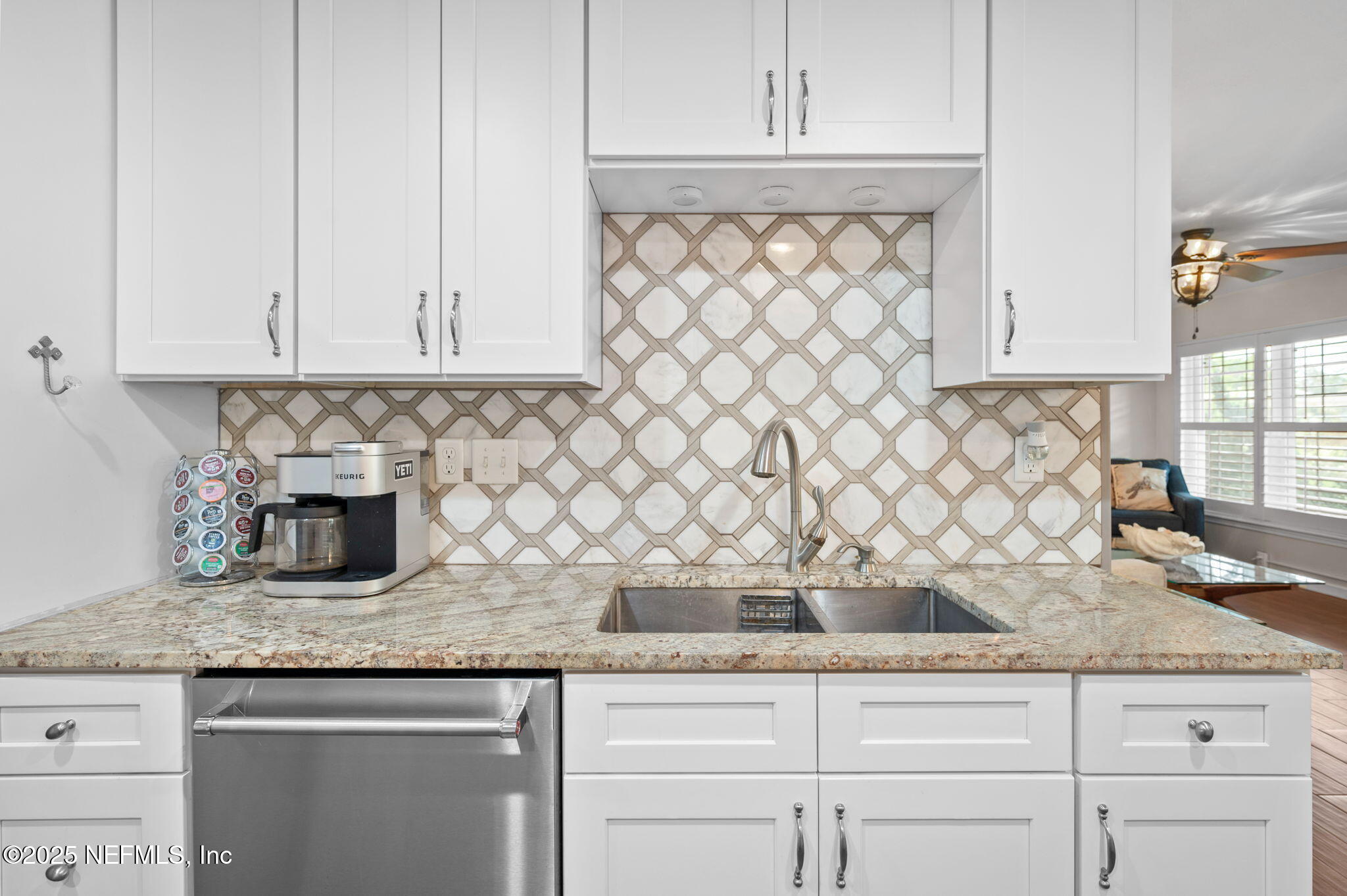 5454 2nd Street St. Augustine, FL 32080 - Photo 14 of 58 a kitchen with granite countertop white cabinets and white appliances