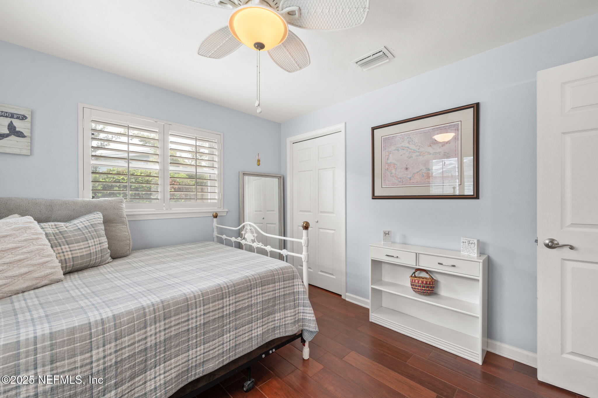 5454 2nd Street St. Augustine, FL 32080 - Photo 26 of 58 a bedroom with a bed and wooden floor