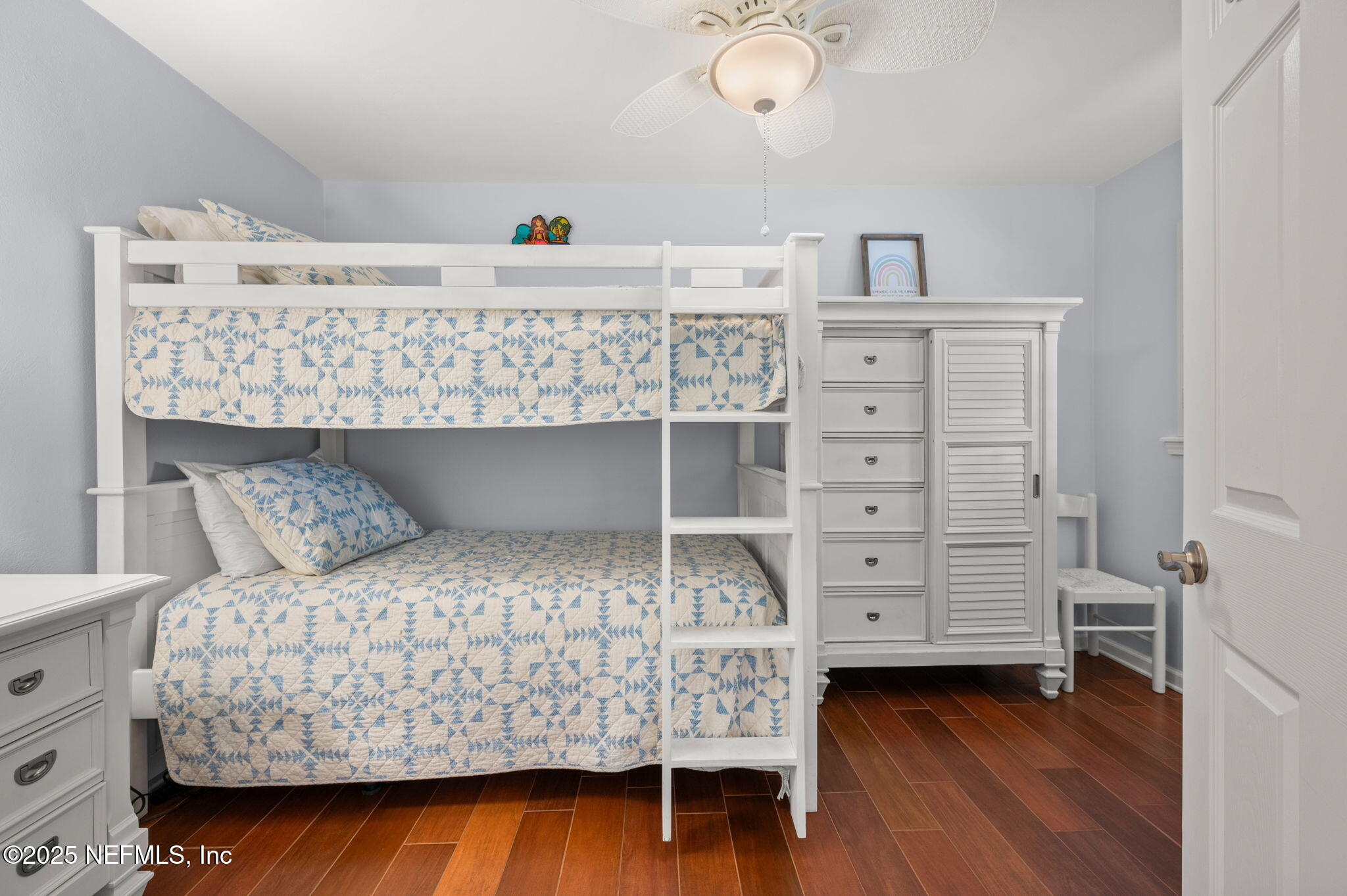 5454 2nd Street St. Augustine, FL 32080 - Photo 32 of 58 a bedroom with a bed and cabinets