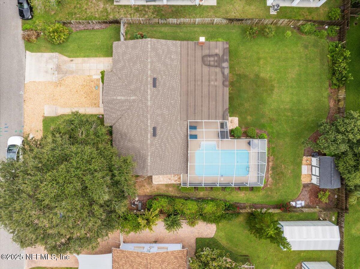 5454 2nd Street St. Augustine, FL 32080 - Photo 51 of 58 an aerial view of a house with a yard and lake view