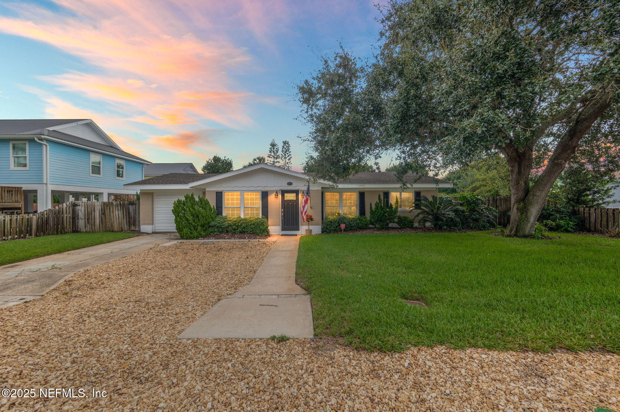 5454 2nd Street St. Augustine, FL 32080 - Photo 54 of 58 a front view of a house with a yard and garage