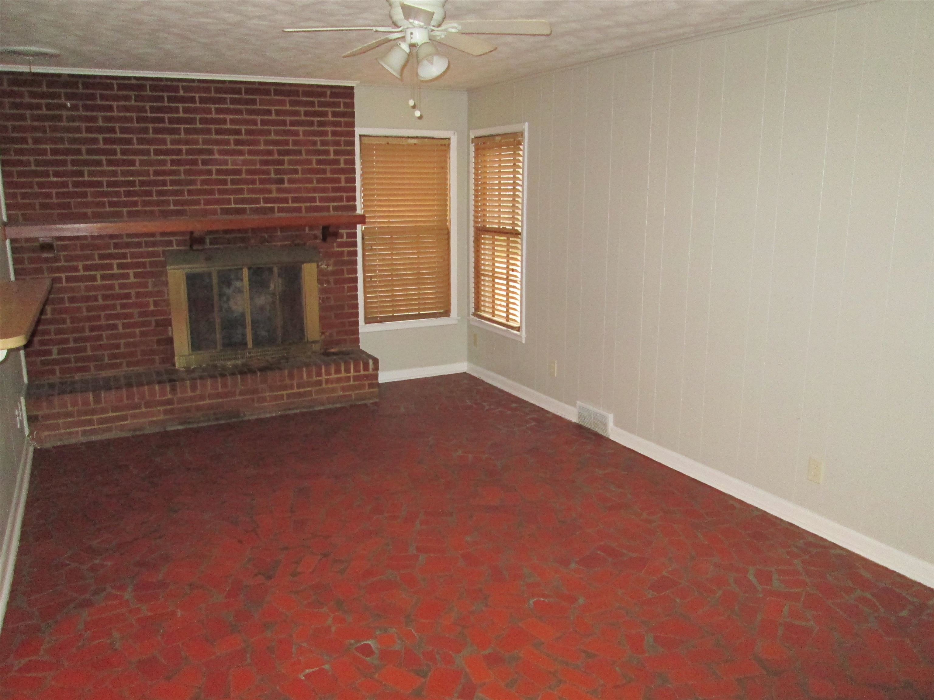 4616 Dunn Road Memphis, TN 38117 - Photo 6 of 20 an empty room with a fireplace