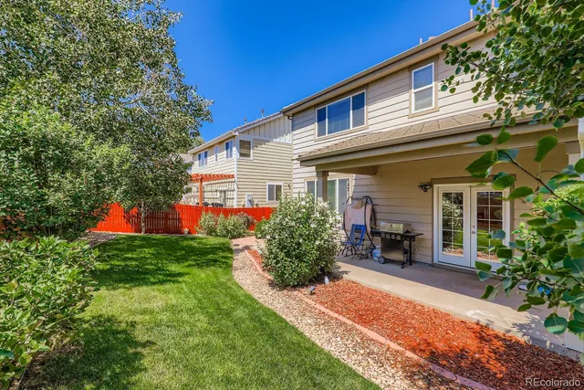 a front view of house with yard and outdoor seating