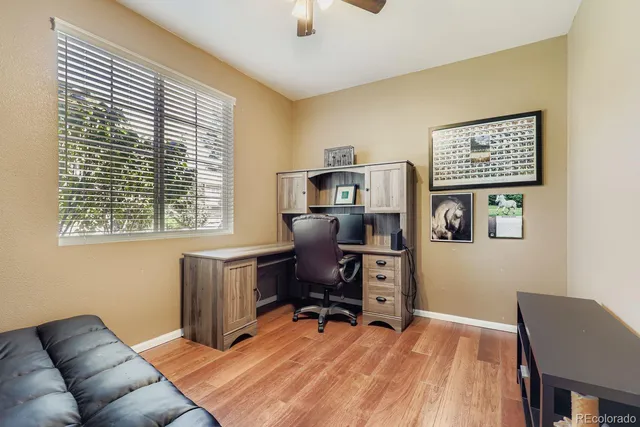 a workspace with furniture and a window