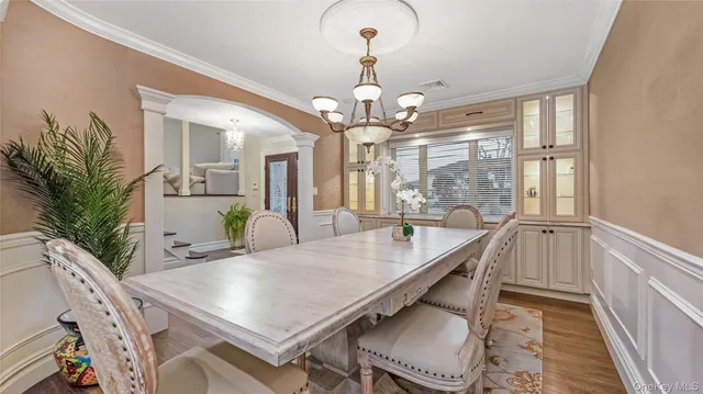 a dining room with furniture and window
