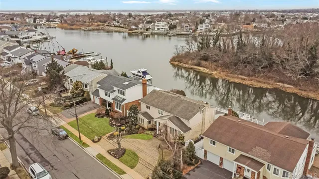 an aerial view of a house with lake view