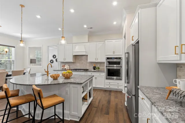 a kitchen with a sink stove and refrigerator