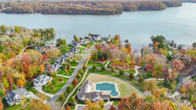 an aerial view of a house with a lake view