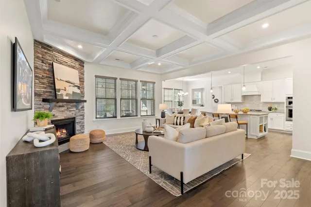 a living room with furniture fireplace and flat screen tv