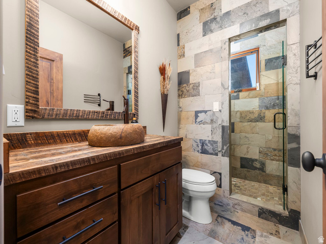22677 East Snowbird Drive, Unit 47 Helper, UT 84526 - Photo 25 of 43 Bathroom with a shower stall and vanity