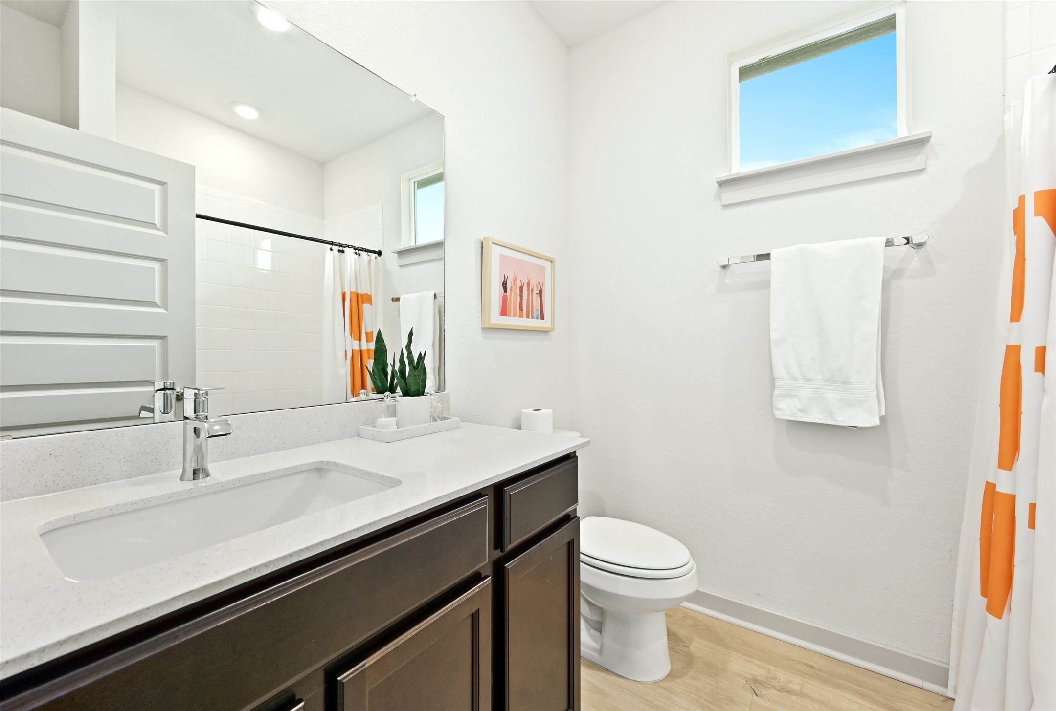 2300 Ranier Court Austin, TX 78754 - Photo 17 of 24 Bathroom with vanity, light wood-style flooring, and a shower with shower curtain