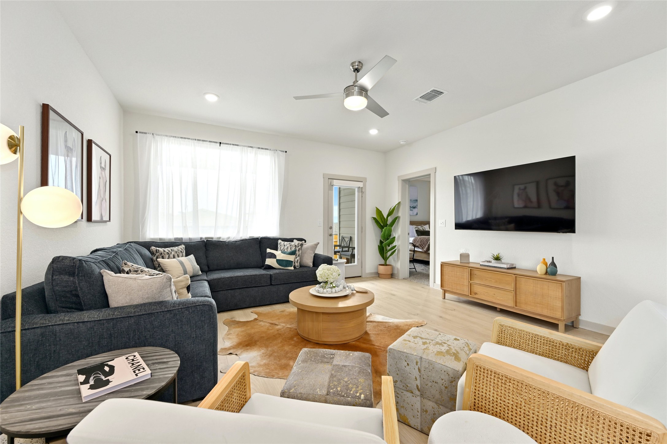 2300 Ranier Court Austin, TX 78754 - Photo 4 of 24 Living area featuring wood finished floors, ceiling fan, and recessed lighting