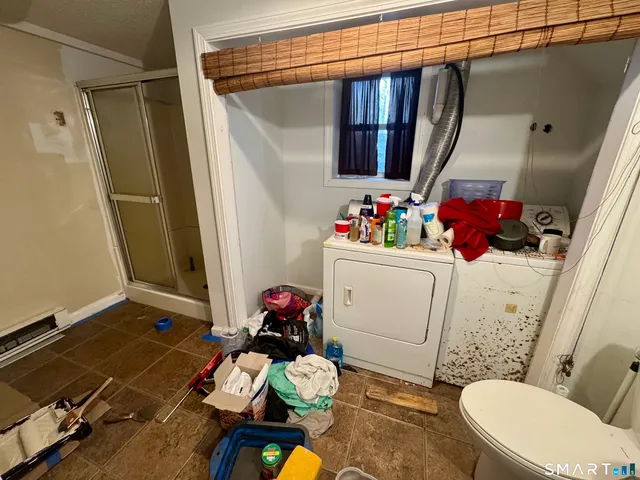 a view of a bathroom with a sink and a window