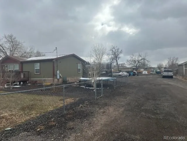 a view of a car park in front of house