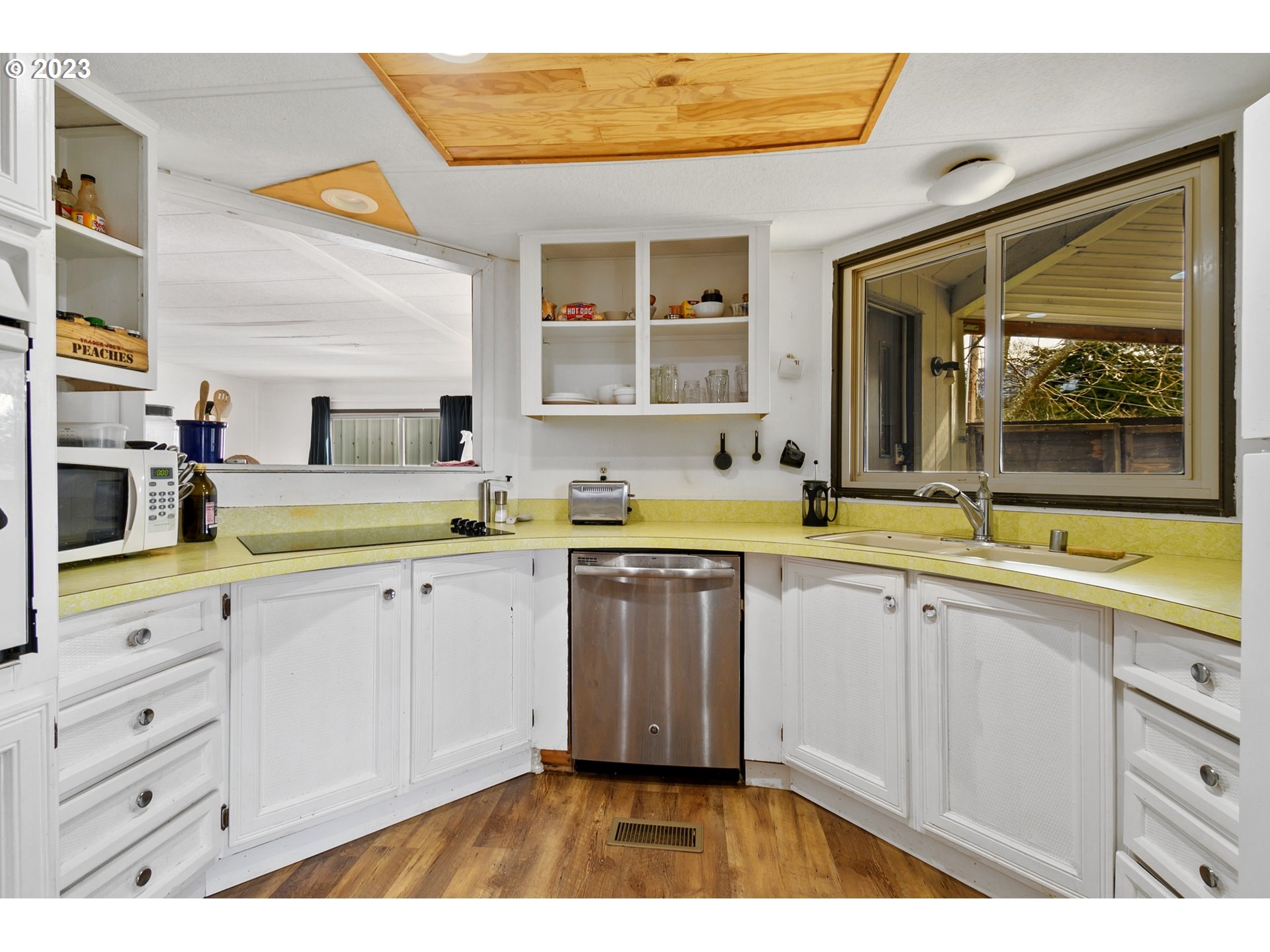 126 Southwest Venture Street Cascade Locks, OR 97014 - Photo 4 of 16 a kitchen with a sink and cabinets
