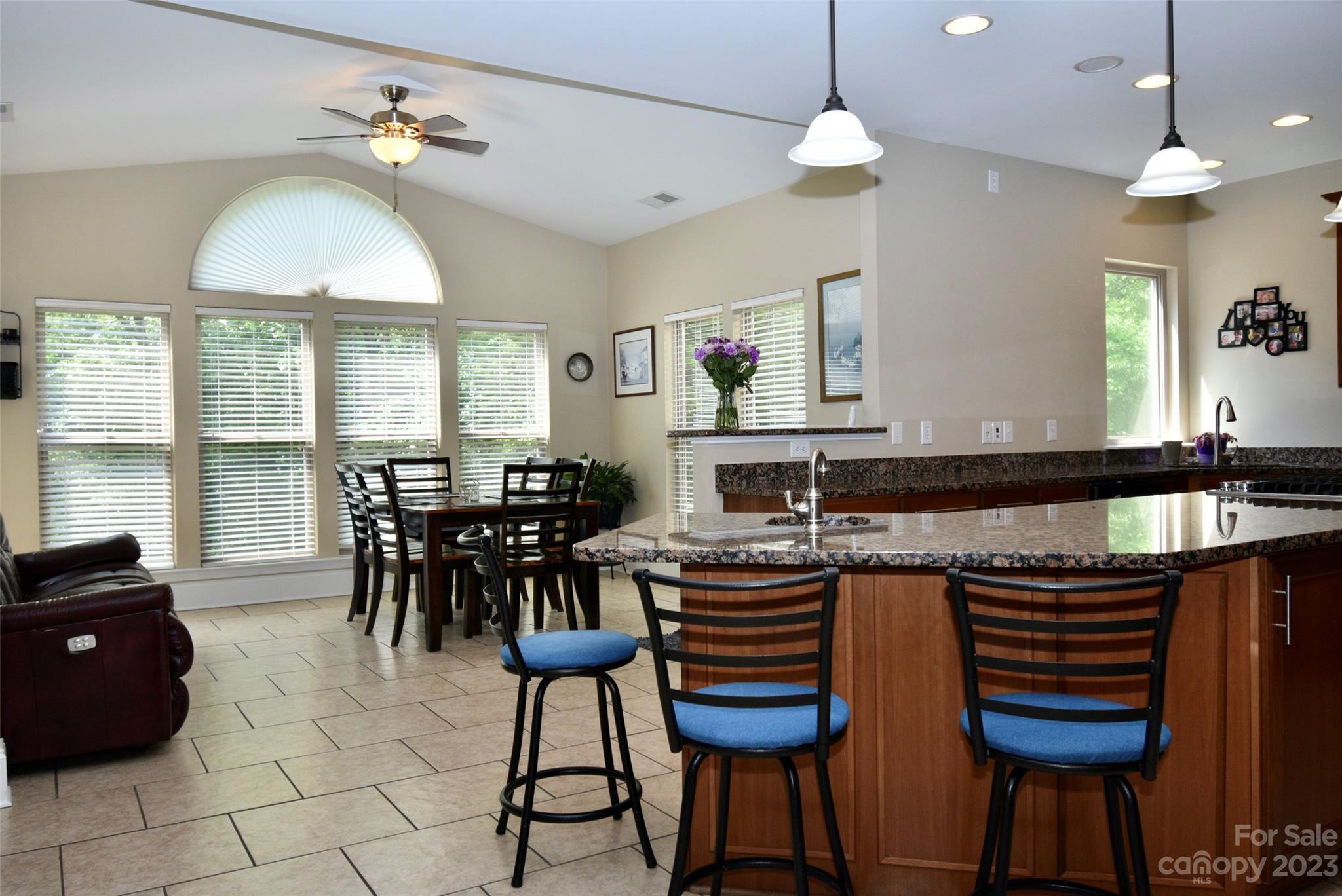6100 Rehobeth Road Waxhaw, NC 28173 - Photo 15 of 37 a view of a dining room with furniture and a chandelier