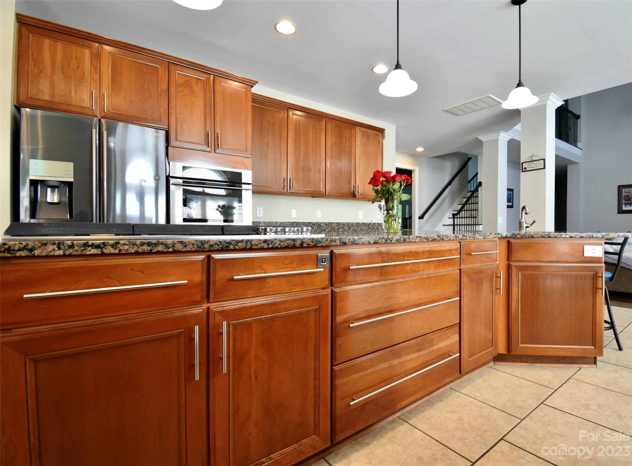 6100 Rehobeth Road Waxhaw, NC 28173 - Photo 17 of 37 a kitchen with stainless steel appliances granite countertop a sink a stove and a wooden cabinets