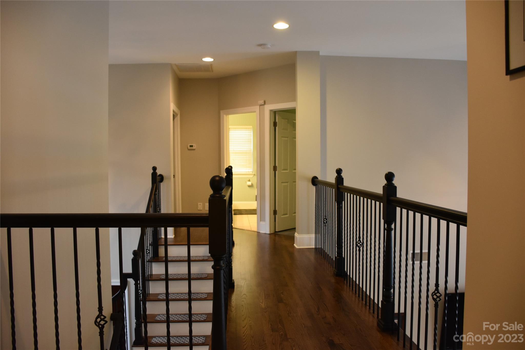 6100 Rehobeth Road Waxhaw, NC 28173 - Photo 20 of 37 a view of a hallway with wooden floor and stairs