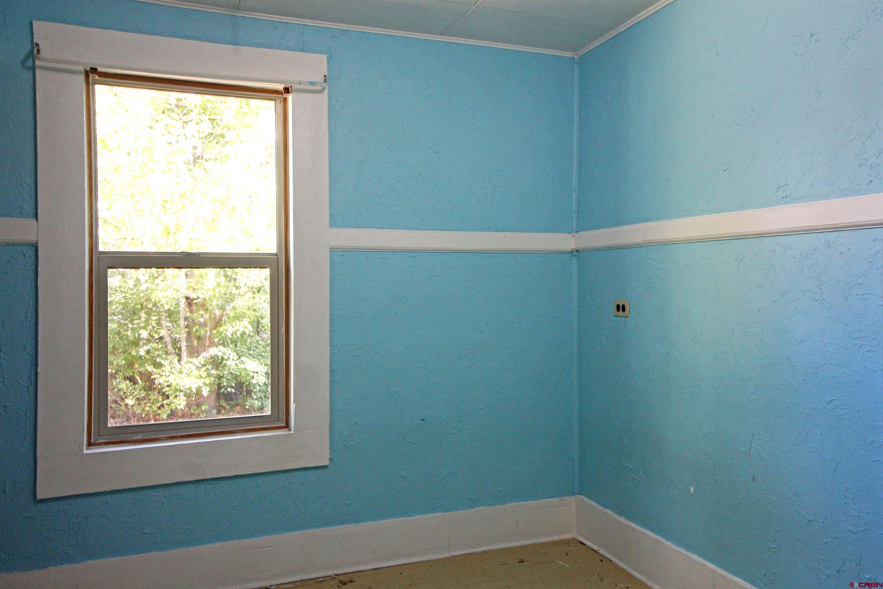 304 South Walnut Street Mancos, CO 81328 - Photo 14 of 31 a small space with a window