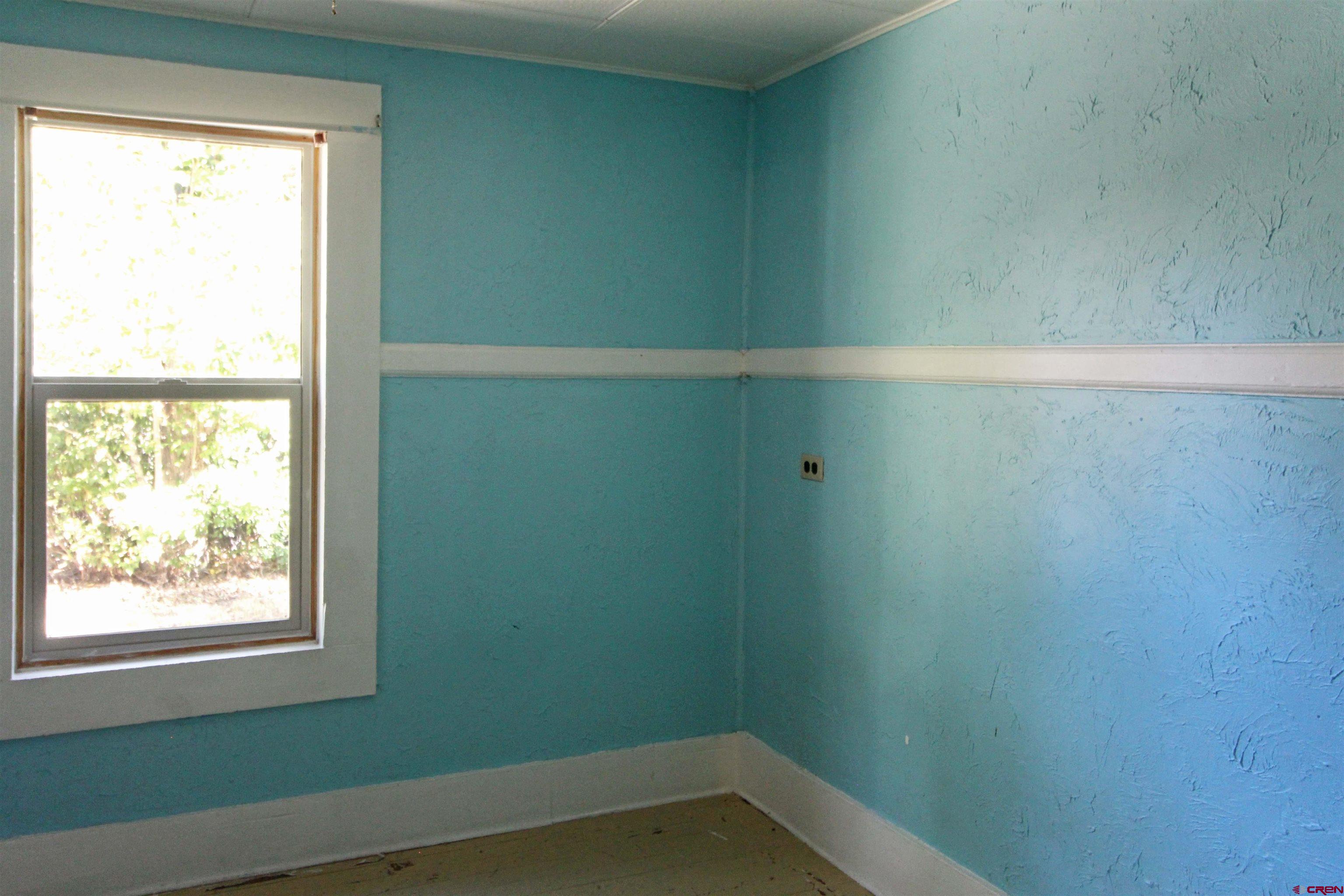 304 South Walnut Street Mancos, CO 81328 - Photo 15 of 31 a small space with a window