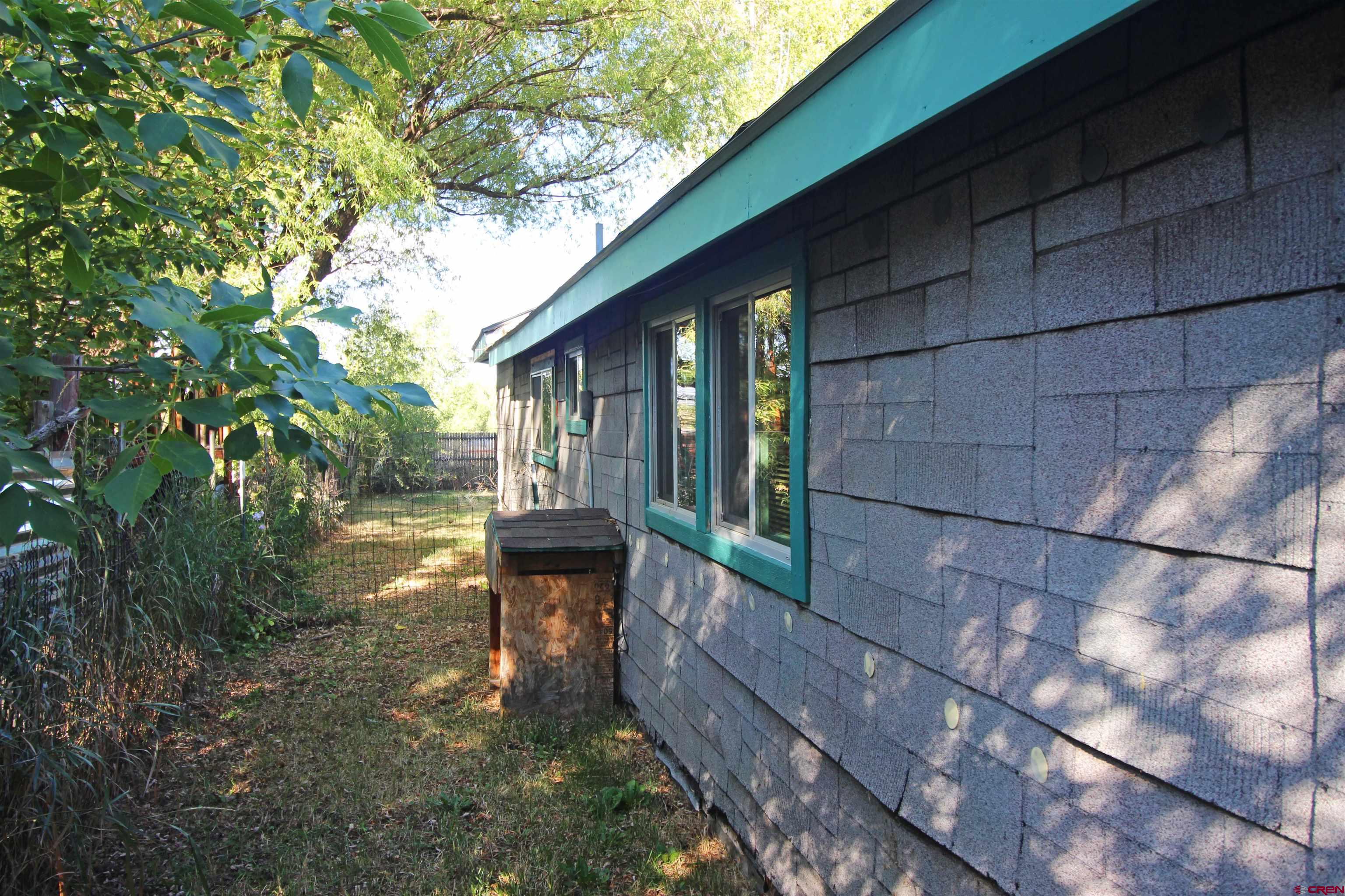 304 South Walnut Street Mancos, CO 81328 - Photo 24 of 31 a view of a house with backyard and sitting area