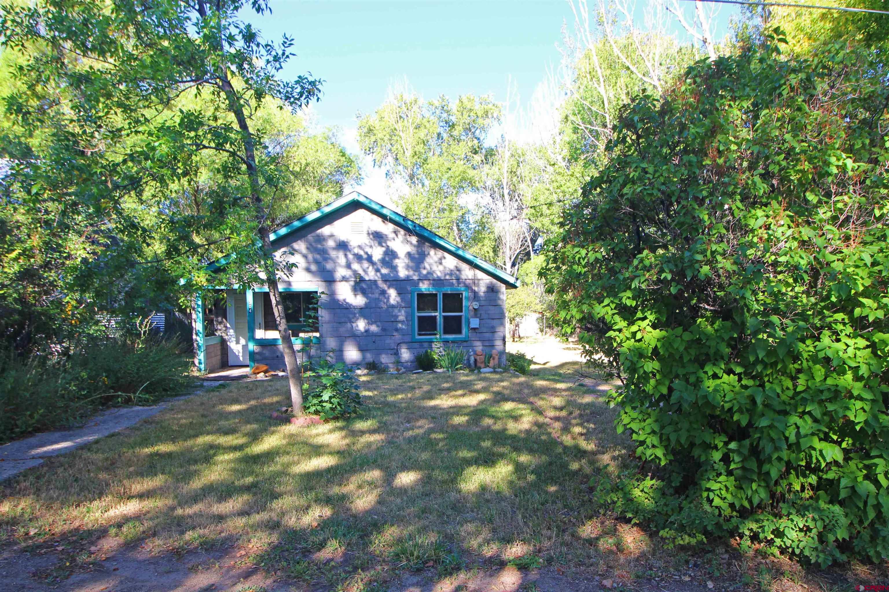 304 South Walnut Street Mancos, CO 81328 - Photo 27 of 31 a view of a house with a yard