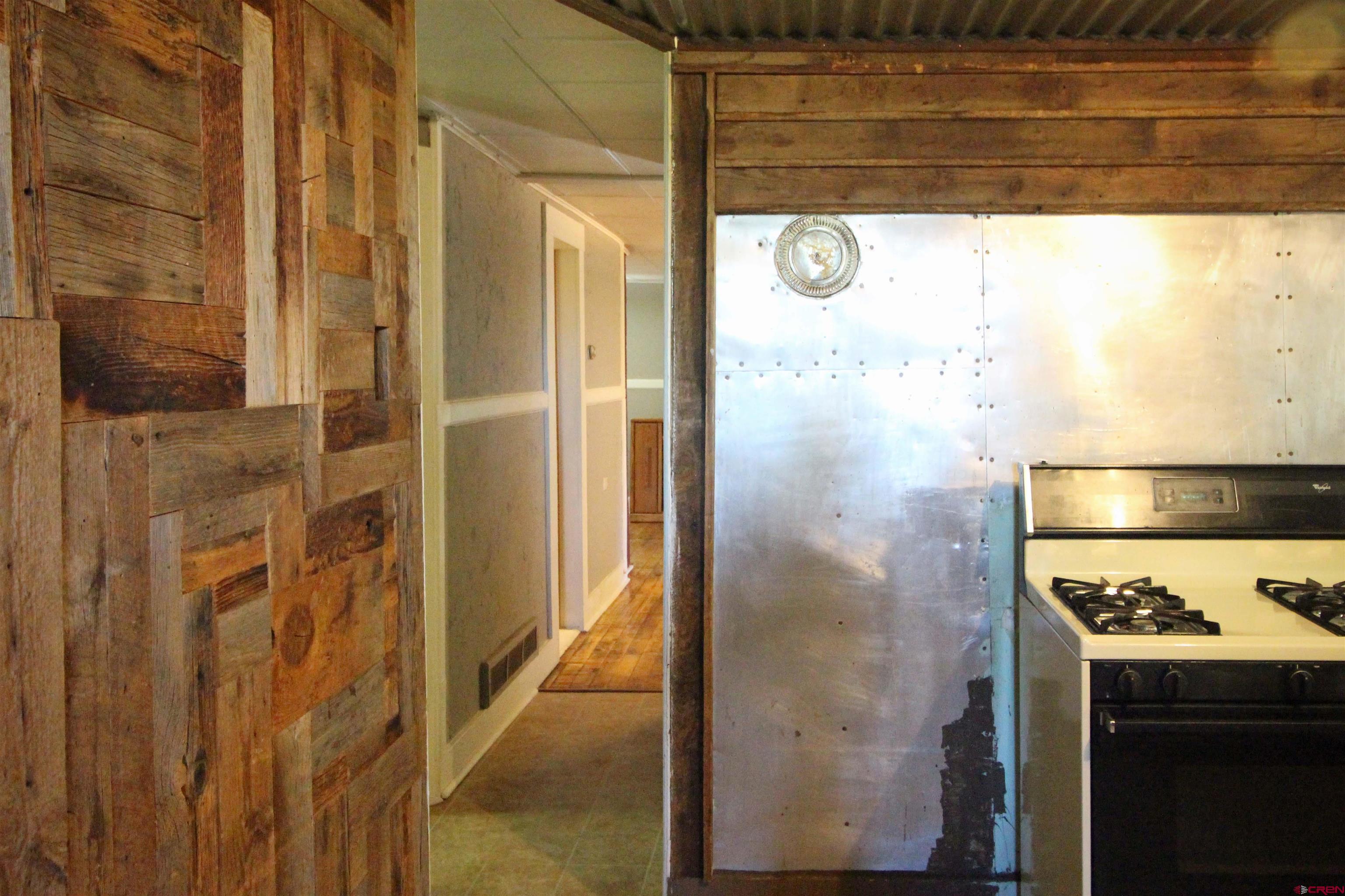304 South Walnut Street Mancos, CO 81328 - Photo 9 of 31 a bathroom with a shower and a sink