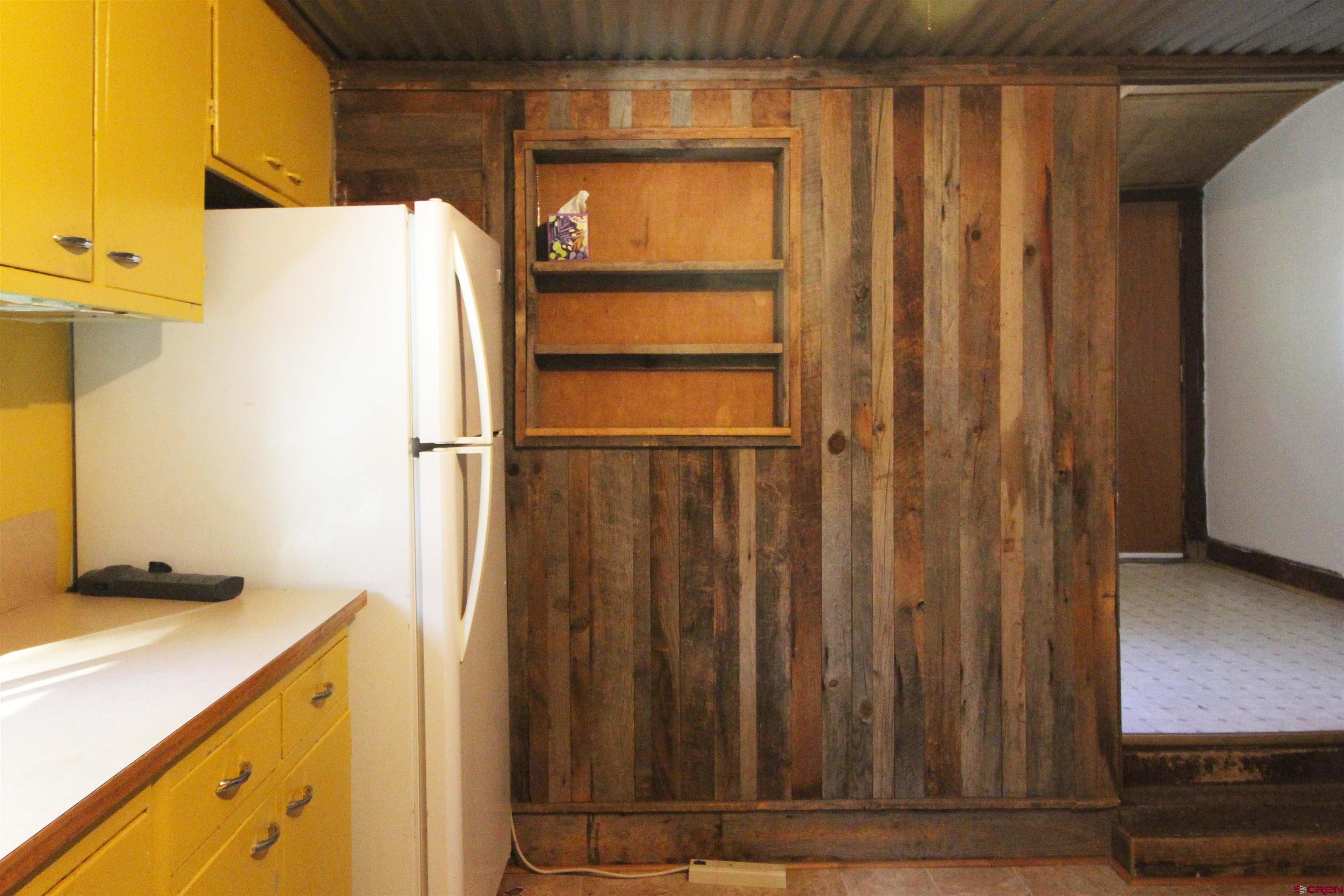 304 South Walnut Street Mancos, CO 81328 - Photo 10 of 31 a bathroom with a sink and a mirror