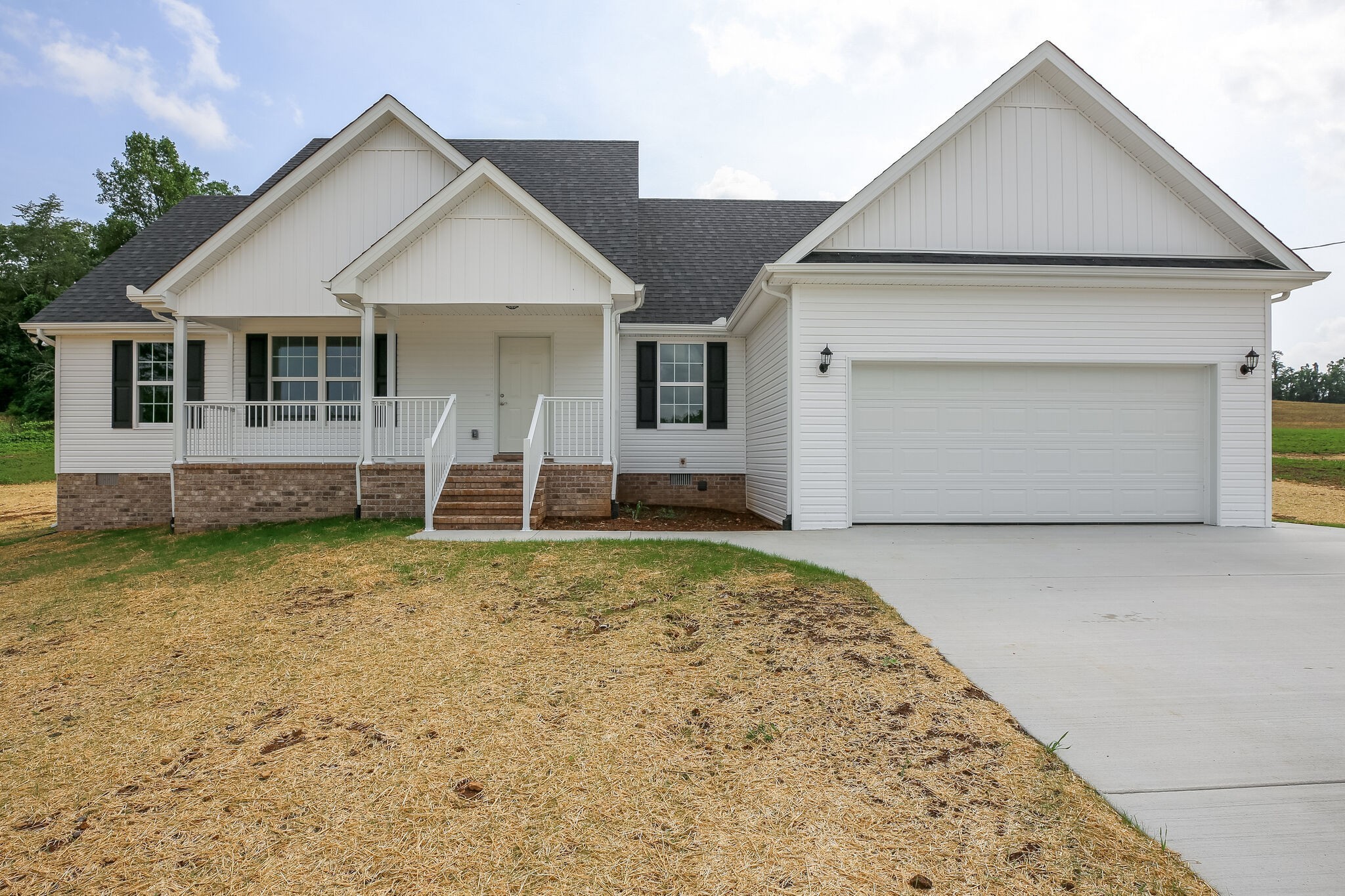 713 Jarrell Road Manchester, TN 37355 - Photo 1 of 25 a front view of a house with a yard and garage