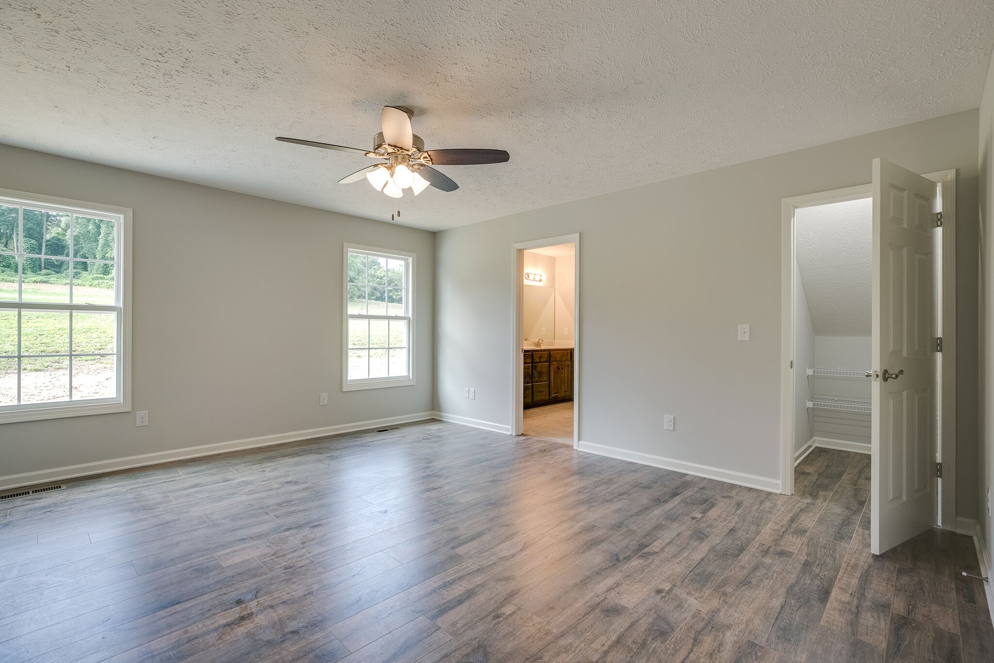 713 Jarrell Road Manchester, TN 37355 - Photo 15 of 25 a view of an empty room with wooden floor and a window